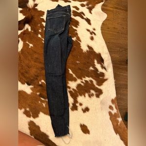 Mother denim dark wash with black fabric stripes down the side